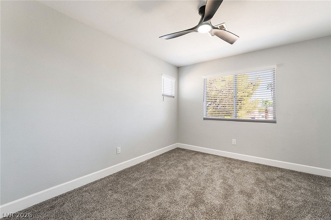 Upstairs bedroom with ceiling fan